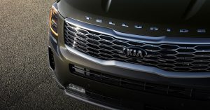 the front grill of a green Kia Telluride