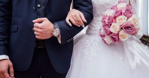 bride and groom linking arms