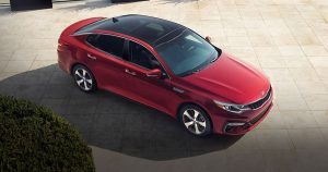 2020 Kia Optima in red shot from above