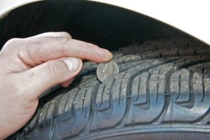 Quarter in the middles of grooves on tire