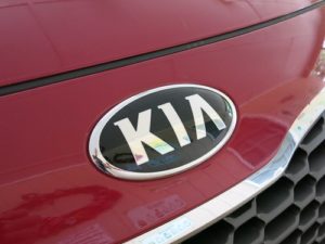 Kia Forte | Kia Symbol on Hood of Car in Red
